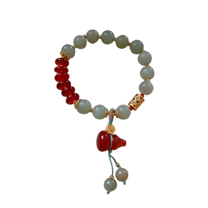 Elegant Chinese style beaded bracelet with light green jade beads and red agate gourd charm