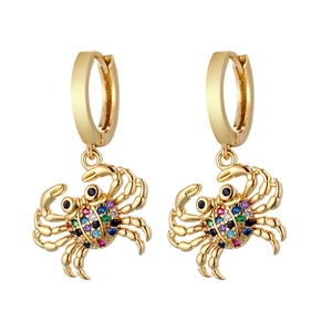 Detail of gold crab earrings featuring colorful pavé crystals and polished hoop design