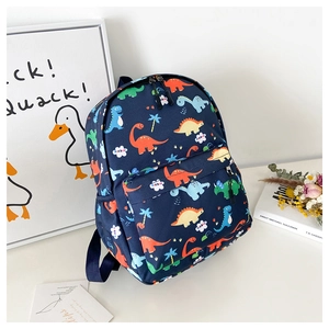 Detail of blue kids dinosaur backpack with side pocket for water bottle and zipper pockets