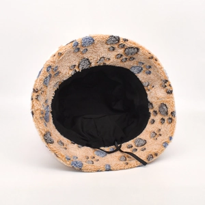 Camel plush bucket hat with blue paw prints and adjustable drawstring for winter warmth