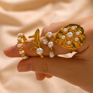 French retro 18K gold-plated ring set featuring irregular pearls on champagne silk fabric
