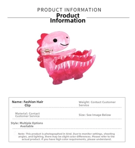 Detailed view of pink dinosaur hair claw clip with its size and material specifications