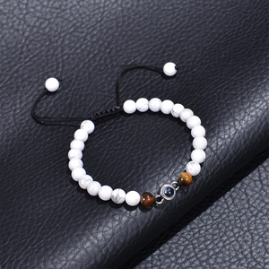 Braided projection bracelet with white turquoise and tiger eye stone on black leather