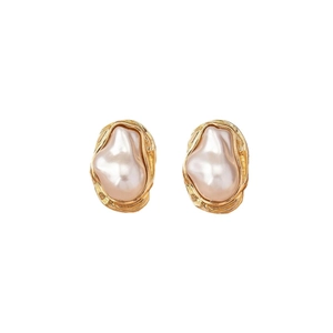 Elegant gold wrinkled metal earrings with baroque white pearls on a clean white background