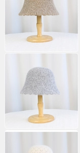 Close-up of diamond knit bucket hat texture on a wooden stand in soft natural lighting