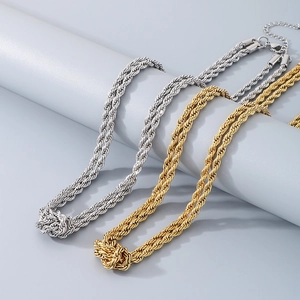 Detail of twisted rope knot necklaces in gold and silver finish with metallic luster