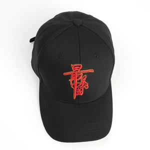 Detailed embroidery of red Chinese characters on a black cotton twill baseball cap
