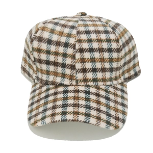 Close-up of vintage plaid wool texture on a classic British style baseball cap