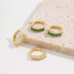 Detail of 18K gold-plated hoops with rectangular green and white zircon stones