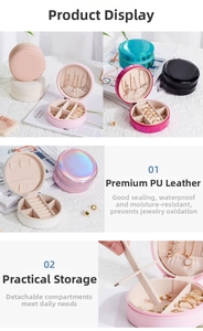 Detail of round PU leather jewelry box with removable dividers and necklace hooks