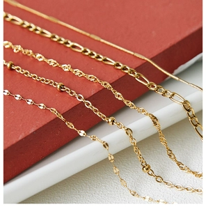 Detailed shot of five gold plated steel necklace styles including snake and box chains