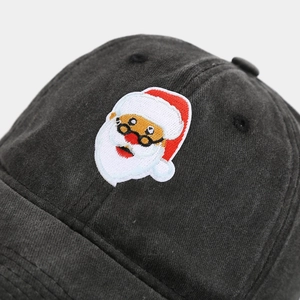 Close-up of vintage grey cotton baseball cap featuring detailed Santa Claus embroidery