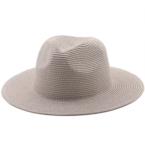 Detail of the dense spiral weave craftsmanship on this beige straw jazz sun hat
