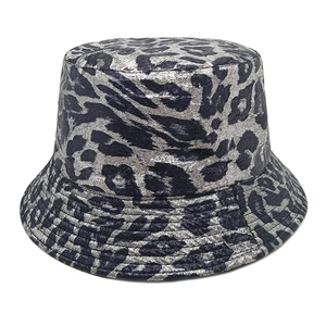 Detailed view of fashionable leopard print bucket hat with metallic silver and black patterns