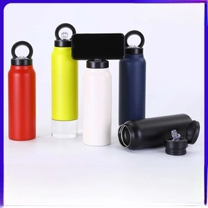 Detail of multi-color stainless steel tumblers with ring lid and phone holder function