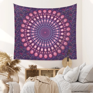 Purple bohemian mandala tapestry hanging on wall above a bed with white bedding