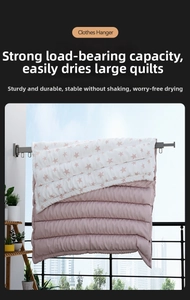 Detail of grey retractable drying rack with windproof hooks holding a heavy quilt