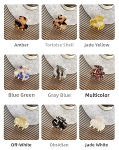 Detail view of mini acetate hair claws in various colors and marble patterns