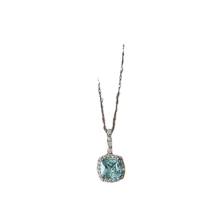 Elegant silver necklace with square blue crystal pendant and halo diamond setting