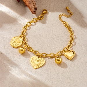 Gold-plated stainless steel bracelet with vintage rose heart pendants on beige surface