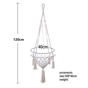 Detail of bohemian macrame hanging cat hammock bed with tassels, 120cm height and 40cm width