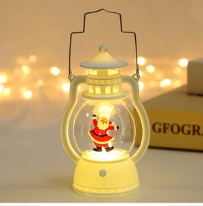 Detail of white Christmas lantern with Santa Claus pattern and warm LED glow