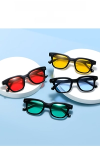 Detailed close-up of fashion sunglasses with colorful lenses on a blue summer background