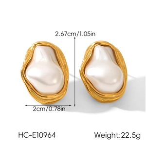 Detail view of large French retro gold earrings with irregular pearls and size measurements