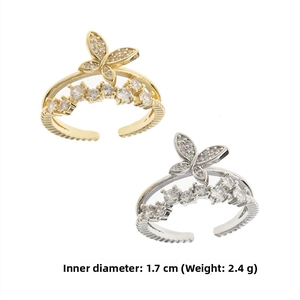 Detail of double-layer butterfly rings in gold and silver with size specs and weights