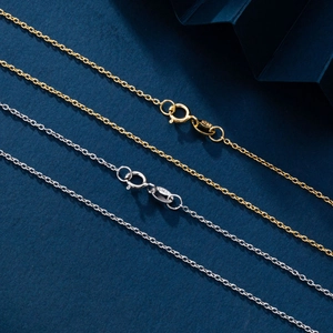 Close-up of S925 sterling silver O-chains in gold and silver with delicate spring clasps