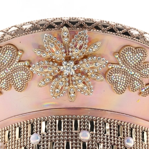 Macro detail of luxury champagne gold party hat with crystals, studs and floral ornaments