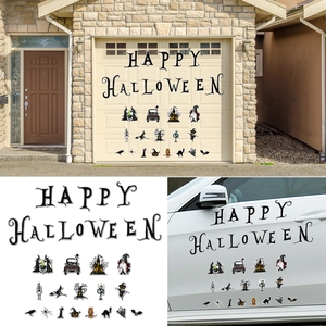 Close-up of Halloween magnetic stickers featuring a gnome, truck, and pumpkin on a car