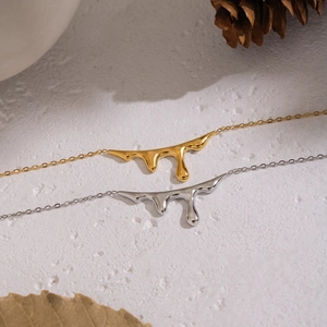 Irregular liquid gold and silver drop pendant necklace in polished stainless steel finish