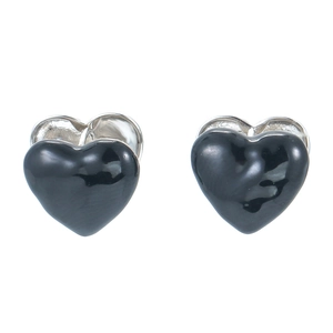 Macro detail of polished black enamel heart stud earrings with silver metal base