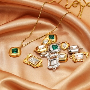 Golden and silver stainless steel necklaces with emerald green square pendants on silk