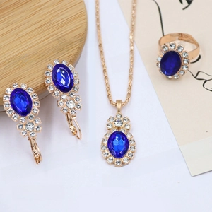 Macro detail of blue gemstone jewelry set including necklace earrings and adjustable ring