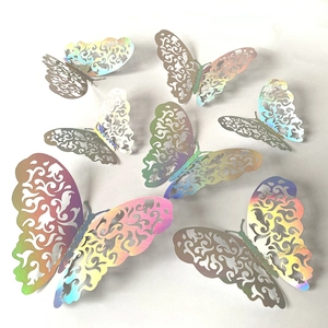 Detailed macro view of 3D colorful metallic butterfly wall stickers on white background