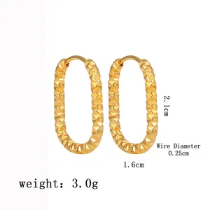 Detailed view of gold plated oval hoop earrings with diamond-cut texture and dimensions