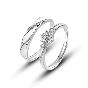 S999 Sterling Silver Couple Rings Set with Zirconia Stones on White Background