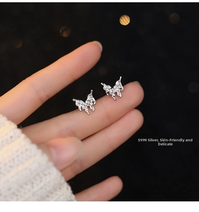 Detailed close-up of S999 sterling silver lava butterfly stud earrings with micro-inlaid zircon