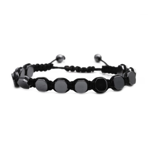 Detailed view of adjustable black hematite hex bead bracelet with braided cord