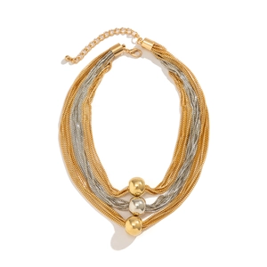 Layered gold and silver metal chain necklace featuring three polished sphere pendants