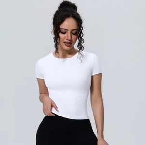 Close-up of white slim-fit yoga top featuring premium elastic fabric and round neckline