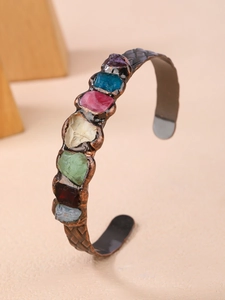 Detail of vintage copper cuff with seven irregular raw crystals in a soldered setting