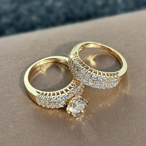 Macro detail of a sparkling round-cut diamond bridal ring set on a golden band