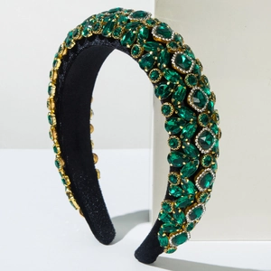 Serre-tête rembourré en strass vert émeraude avec base dorée et doublure en velours noir