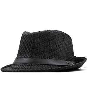 Detail of a black woven fedora hat featuring a stylish leather band and metal buckle