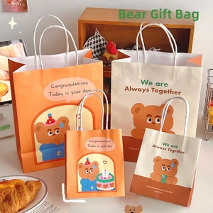 Cute cartoon bear paper gift bags with handles in various sizes for birthday parties