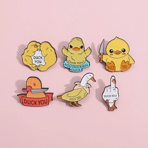 Set of 6 humorous yellow enamel pins featuring banana duck and muscle duck characters