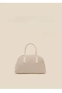 Detailed view of the white suede Boston bowling bag with soft texture and metal zipper